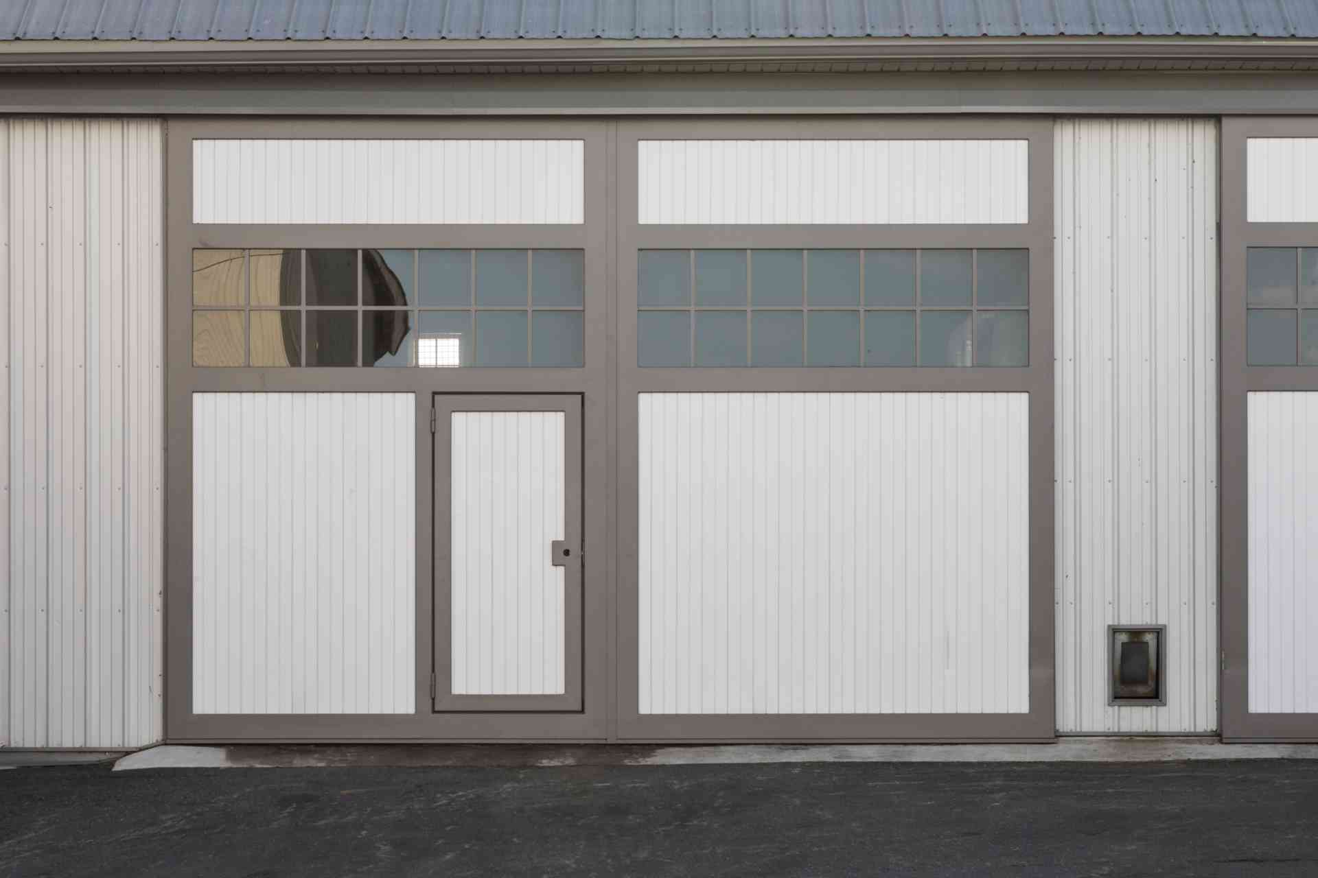 A barn exterior with single barn door