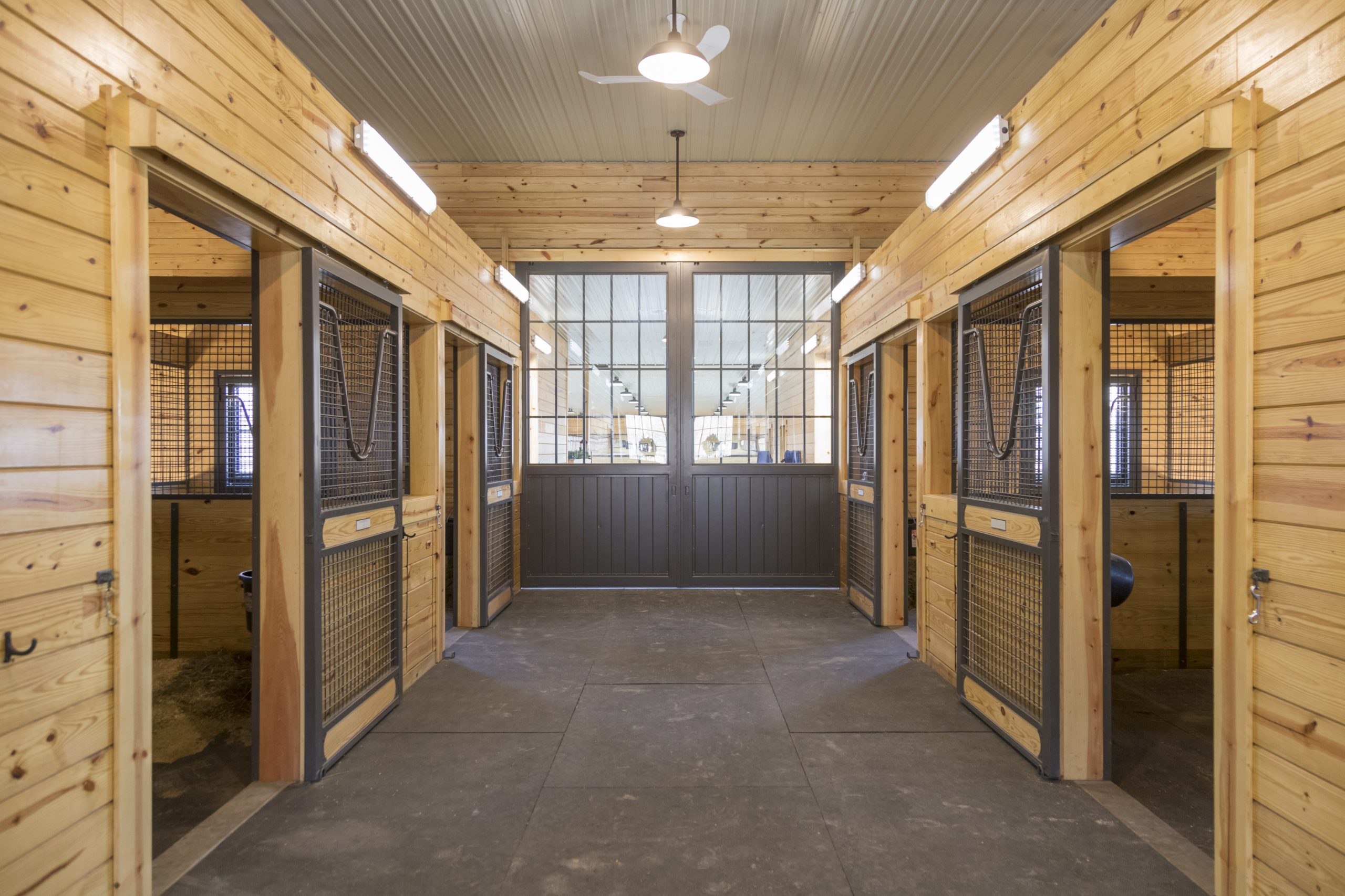 Wood horse stall with screen doors