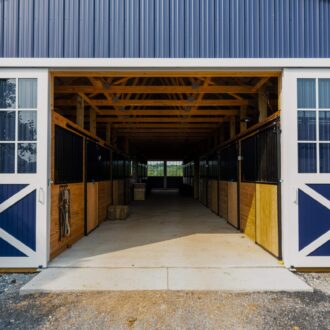 Exterior of a barn with open doors
