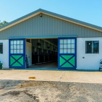 Exterior of horse stable with sliding doors