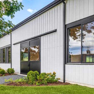 A new horse barn with sliding doors