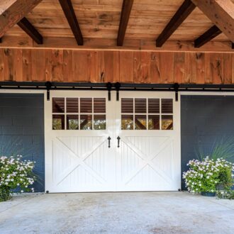 White metal sliding horse barn doors