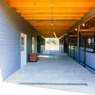 A walkway in front of low stall fronts
