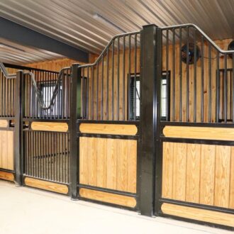 Stall fronts with protective grills, and sliding stall doors.