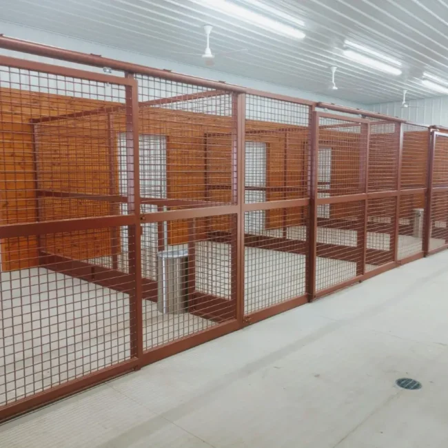 Indoor screen stalls with brown protective mesh grills, showcasing options for customizable stall systems.