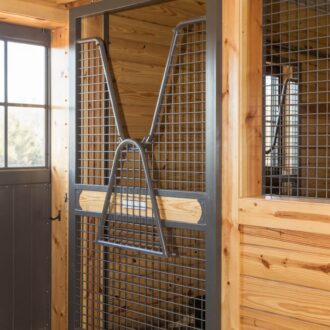 Horse stall gate with protective stall grill, natural wood finish, and metal accents. Perfect for modern barns.