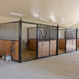A row of open horse stalls