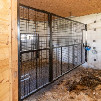 A metal horse stall partition