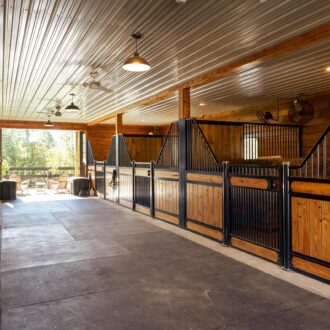 An aisle of horse stalls