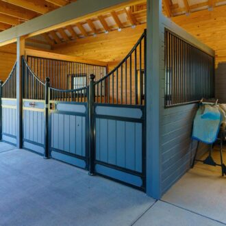 Modern stable design with protective stall grills and mesh, featuring stylish grey and black finish options.