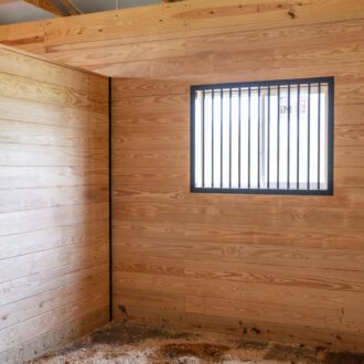 A horse stall made with beautiful Tongue & Groove Lumber.