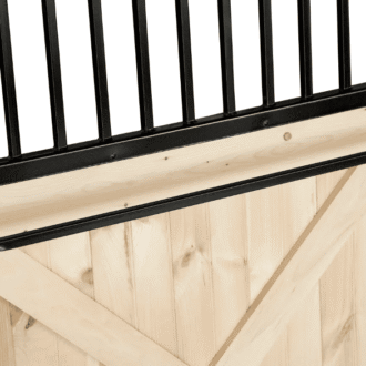 Blanket bar for sliding stall doors.