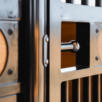 Close-up of stall door with spring pull latch.