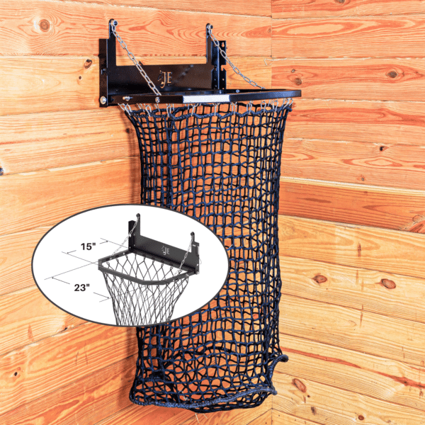 Black mesh haynet hay feeder on wooden wall with chain suspension. Ideal for barn use.