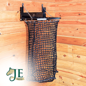 Black mesh haynet hay feeder on wooden wall with chain suspension. Ideal for barn use.