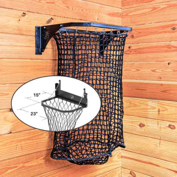 Black mesh haynet hay feeder on wooden wall. Ideal for easy feeding in stalls for horses, sheep, and other livestock.