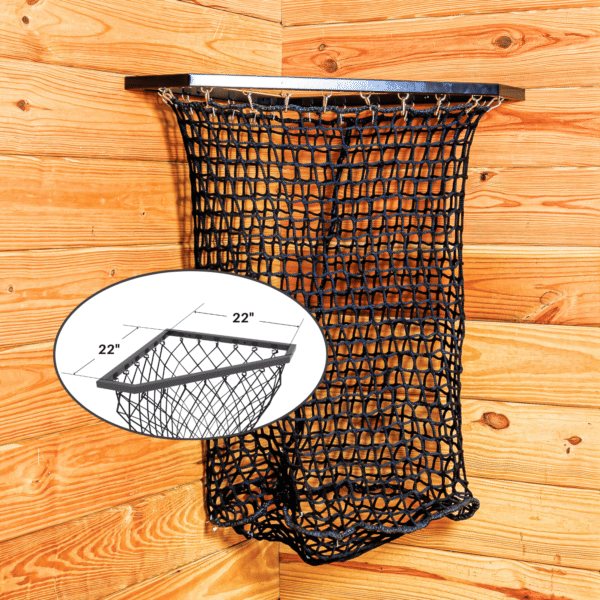 Black mesh haynet hay feeder on wooden wall. Ideal for easy feeding in stalls for horses, sheep, and other livestock.