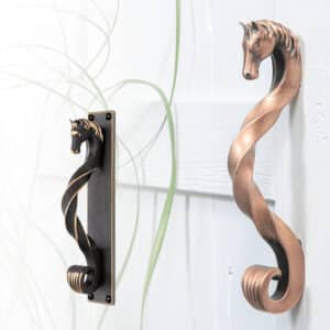 Decorative horse head handles for barn doors, available in 7 colors and finishes.