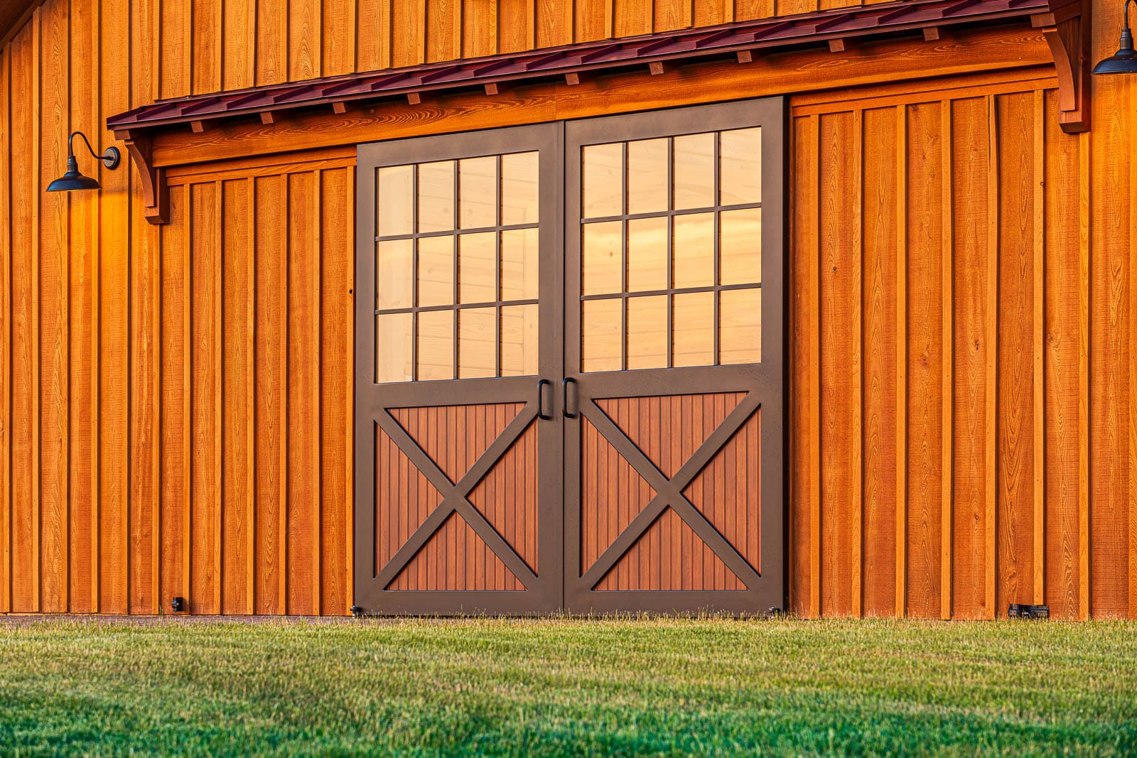 Closeup of custom aluminum sliding barn doors with deluxe wood-grain powder coated finish
