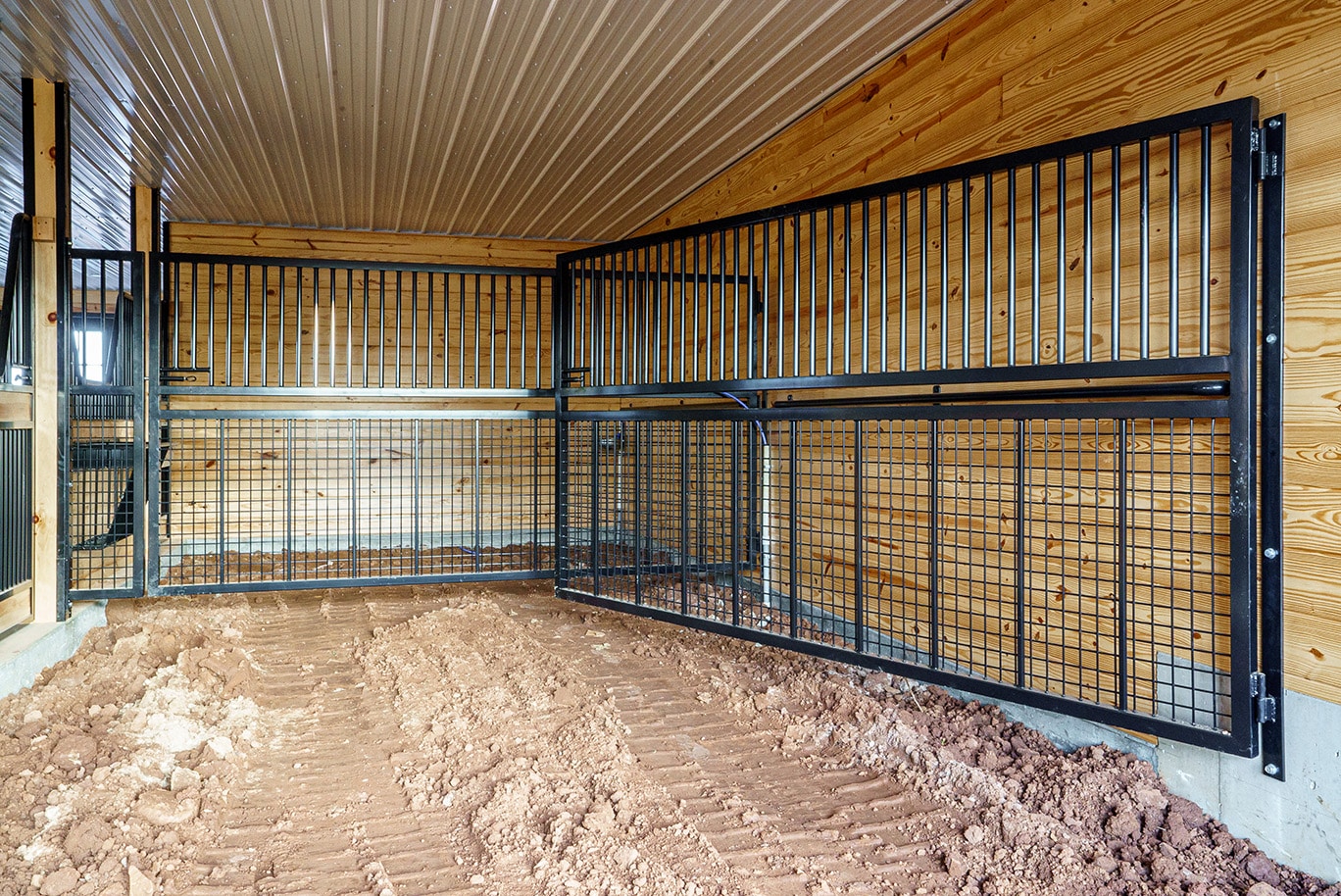 Adjustable stall partitions made by J&E Grill Manufacturing make it possible to create larger or smaller stall spaces, as needed, and allow airflow.